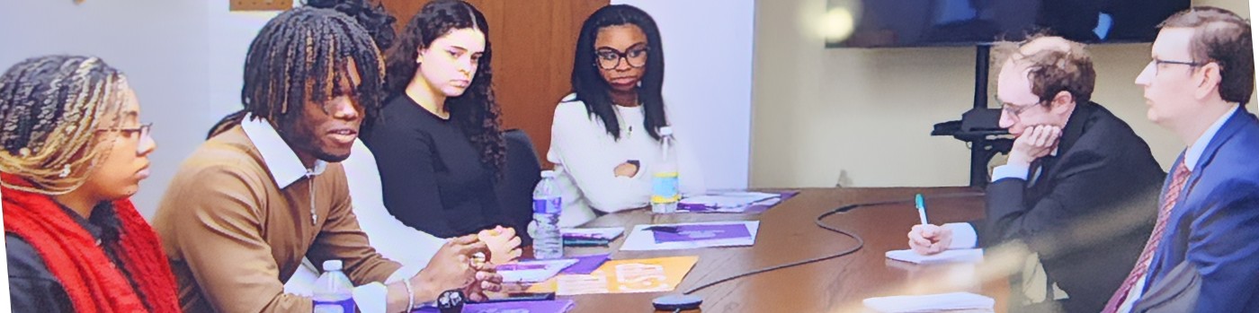 Marcel Cato chairing an NYU HEOP advocacy meeting with staffers at the NYS Capitol